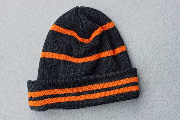one striped black orange woolen winter hat