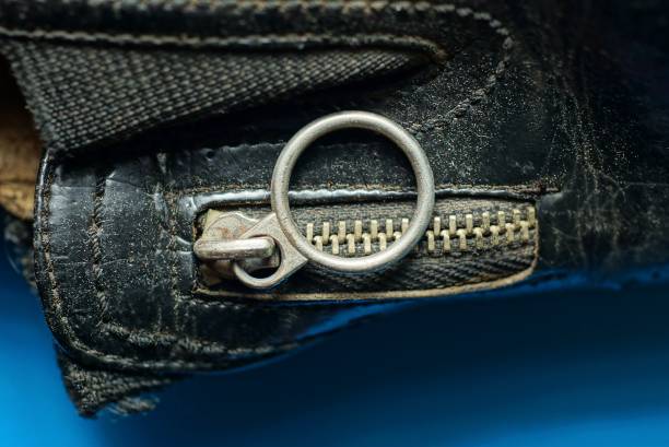 istock closed gray metal zip with a ring on black leather clothes 1301397247
