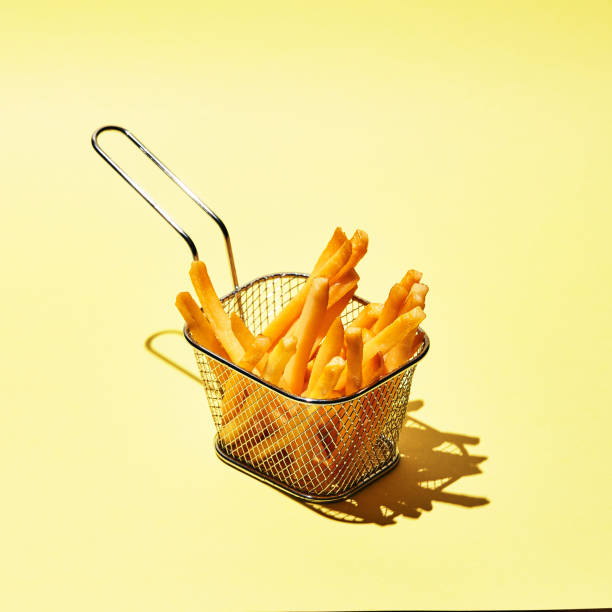 istock French fries in metal wire basket 1301400323