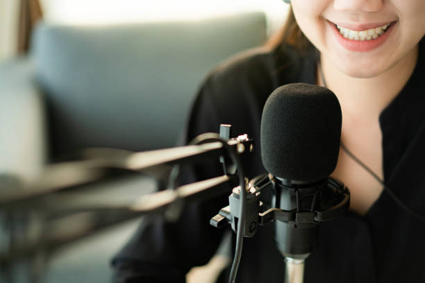 istock Asian woman making a live broadcast or podcast 1301400357