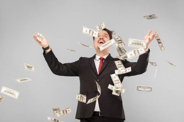 istock Man threw all the money up and they fly around 1301400497