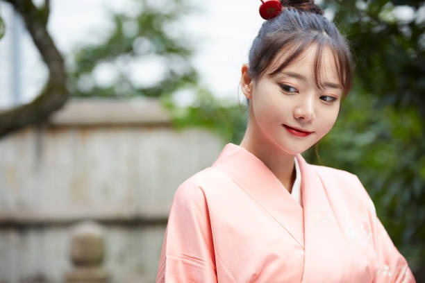 istock A young woman in a kimono is walking around 1301401151