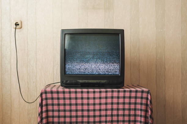 istock Old TV with small screen broadcasting flickering black and white image 1301401517