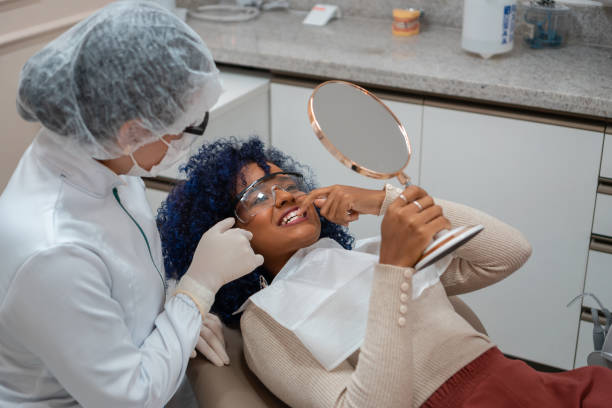 istock Patient showing teeth to his dentist 1301401541