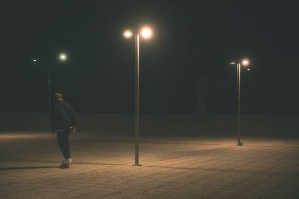 istock Young Men With Skateboard at Night 1301402498