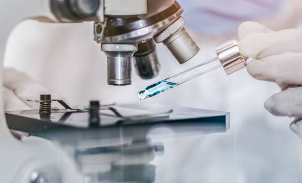 istock scientist with equipment and science experiments laboratory glassware containing chemical liquid. 1301402741