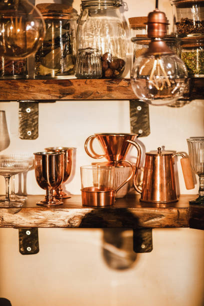 istock Kitchen shelves with various glass and utencils in daylight 1301403124
