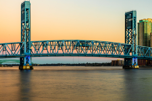 Daylight fades around the John T. Alsop Jr. Bridge, popularly known as the Main Street Bridge, over the St. Johns River in Jacksonville, Florida.