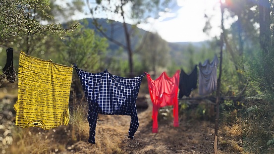 Camping clothesline with a colourful pieces of clothing drying in the sun. Geehi Flats, Snowy Mountains, Kosciuszko National Park, NSW
