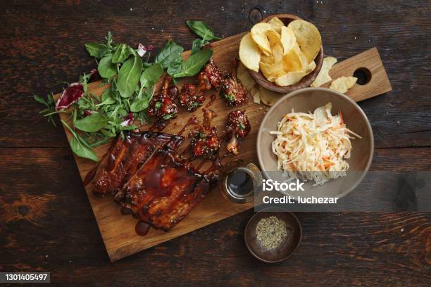 Bbq Lollipop Chicken Wings And Spicy Glazed Pork Ribs Stock Photo - Download Image Now
