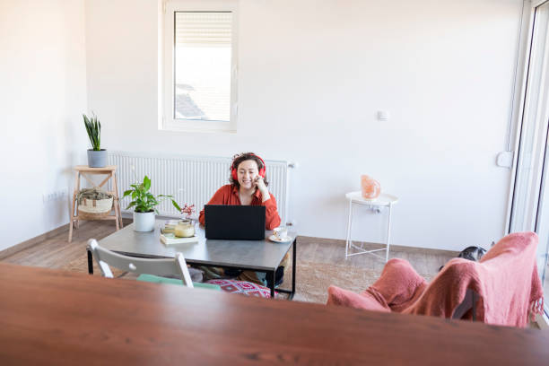 istock Young Woman living and working with pets 1301406660
