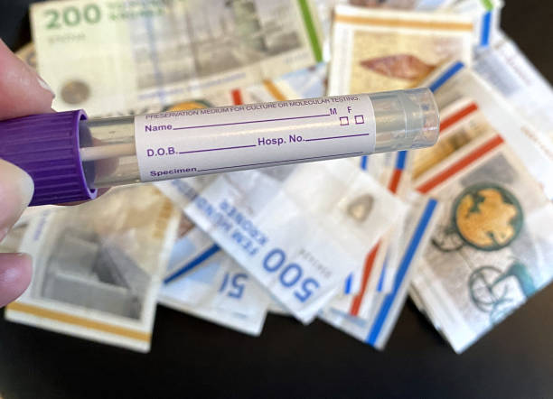 istock Test tube for COVID-19 against Danish currency. 1301407135