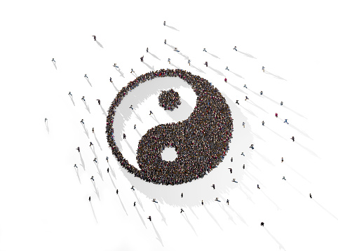 Large Crowd of People Forming Yin Yang Symbol on White Background