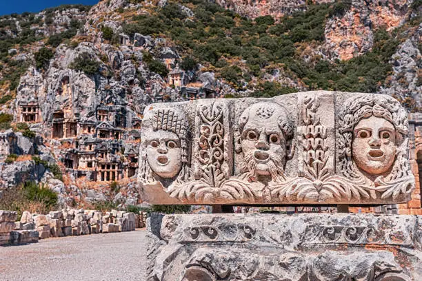 Popular archaeological site and ancient city of Myra in Turkey - historical landmark that attracts numerous excursions and tourists every day. The tombs and basrelief are carved right into the rock