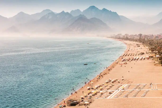 Photo of Aerial view of the famous longest Konyaalti beach in Antalya. Vacation and tour on the Mediterranean coast of Turkey