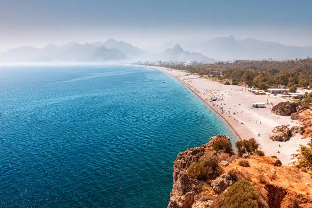 Photo of Aerial view of the famous longest Konyaalti beach in Antalya. Vacation and tour on the Mediterranean coast of Turkey