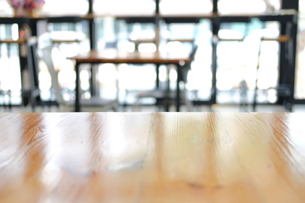 istock wooden table with cafe coffee shop blur background 1301407878