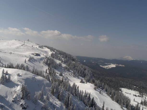 istock sunny winter day with fresh snow in ski resort 1301409307