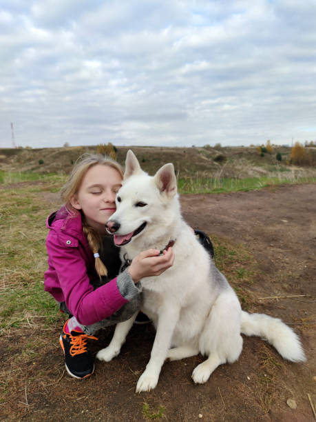 istock The girl happily communicates with her favorite dog 1301409971