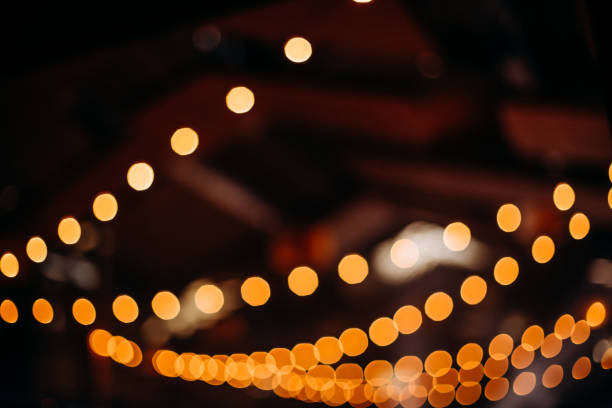 istock retro street garlands yellow light beautiful blur 1301410933