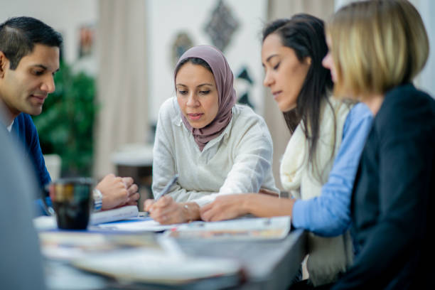 istock Multi ethnic group of entrepreneurs in a meeting 1301410951