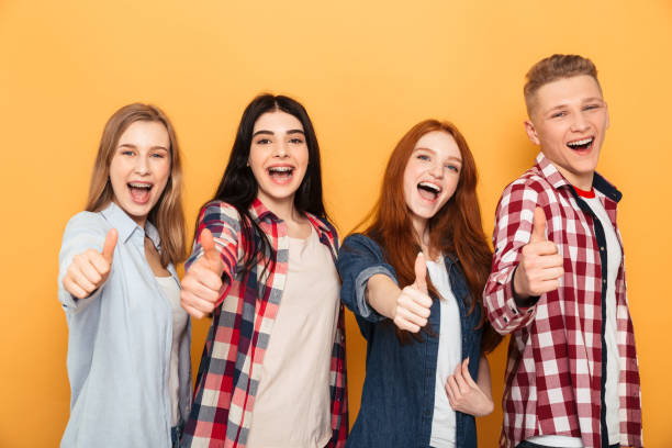 istock Group of smiling school friends 1301411218