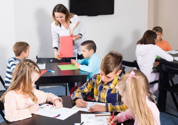 istock Children of elementary age having class of art 1301411398
