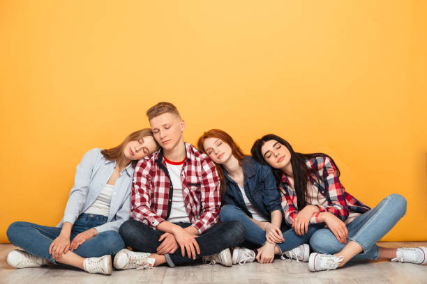 istock Group of young bored school friends 1301411966