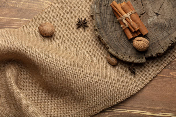 Anise star and cinnamon stick on a wood.
