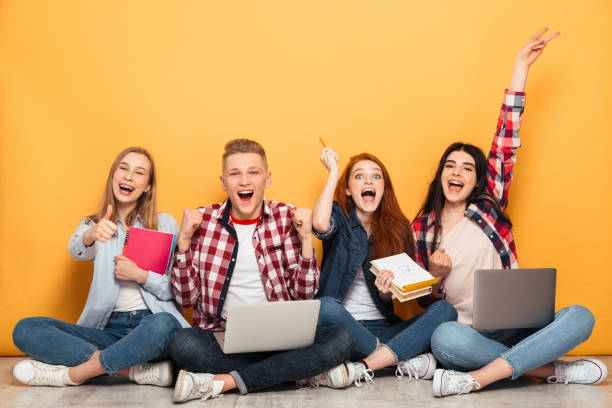 istock Group of happy school friends 1301412242