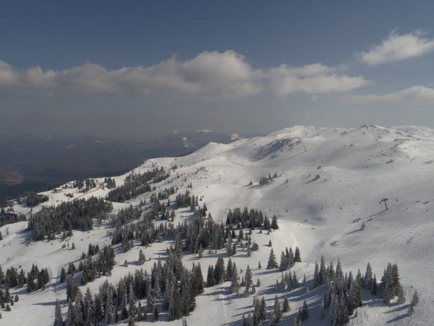 istock sunny winter day with fresh snow in ski resort 1301412271