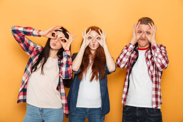 istock Group of happy school friends grimacing 1301413328