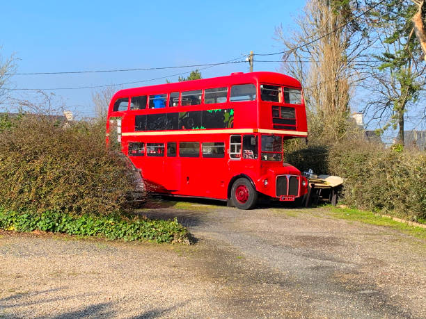 istock Typical red English bus parked in a car park 1301413434