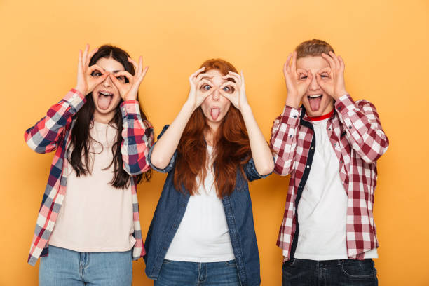 istock Group of funny school friends grimacing and having fun 1301414412