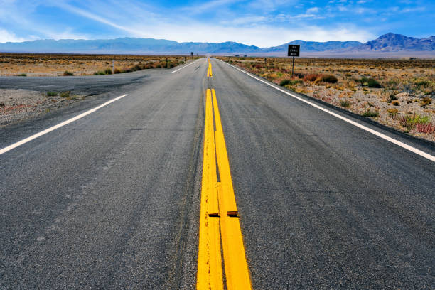 istock Road and the mountains in Nevada, USA 1301414795