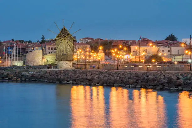 Amazing view of the windmill, located on a narrow man-made isthmus at the entrance of the UNESCO - protected ancient town of Nessebar,seaside resort. Tourism