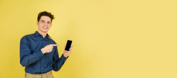 istock Caucasian man's portrait isolated on yellow studio background with copyspace 1301417501