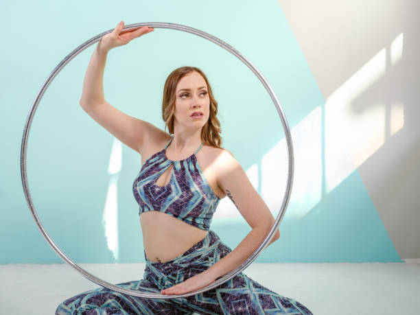 istock Female gymnast with hoop practicing 1301417617