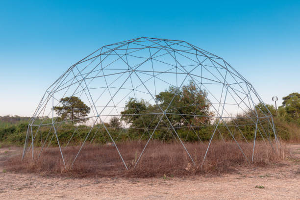 The steel frame of a geodesic dome is built on nature. Such a frame has a large load-bearing capacity and wind resistance The steel frame of a geodesic dome is built on nature. Such a frame has a large load-bearing capacity and wind resistance geodesic dome stock pictures, royalty-free photos & images