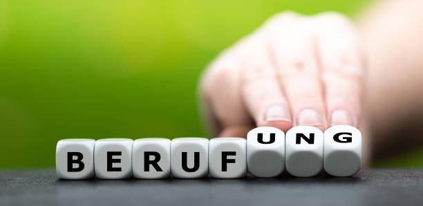 istock Hand turns dice and changes the German word 