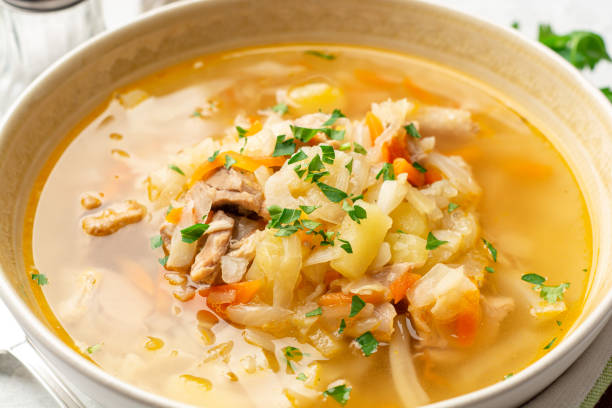 istock Traditional Russian cabbage soup Shchi on concrete background 1301421716