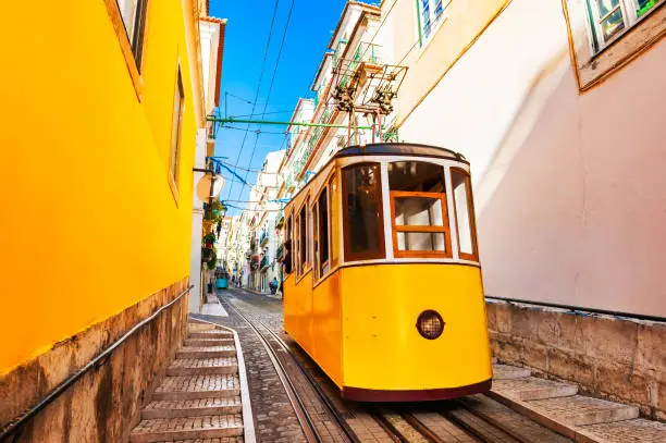 Photo of Yellow funicular on the railway in Lisbon, Portugal.
