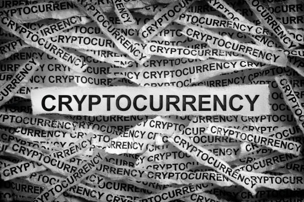 istock Torn pieces of paper with the word Cryptocurrency 1301424769