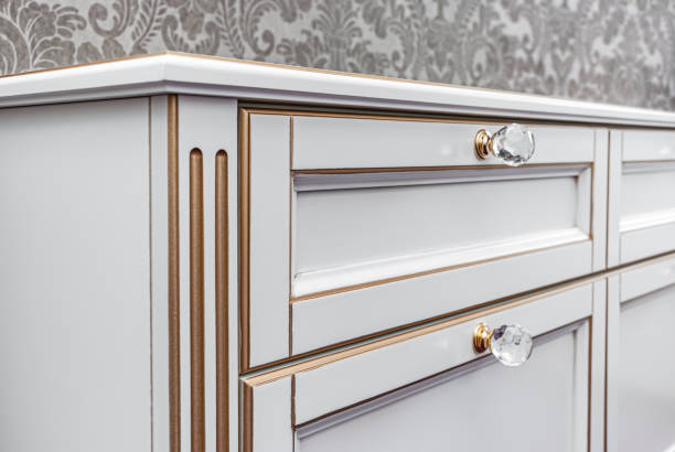 istock Classical style nightstand with drawers and crystal handles 1301424899
