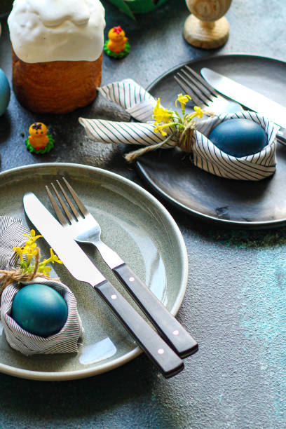 istock Easter cake and Easter eggs festive table setting traditional decoration and treats. Happy easter! portion on the table healthy meal snack outdoor top view copy space  food background rustic 1301425981