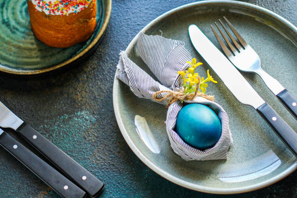 istock Easter cake and Easter eggs festive table setting traditional decoration and treats. Happy easter! portion on the table healthy meal snack outdoor top view copy space  food background rustic 1301426000