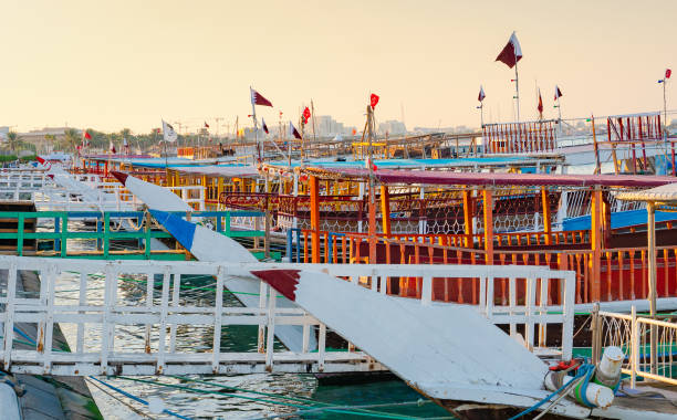 istock Traditional dhows parked together in Doha Corniche. 1301429279