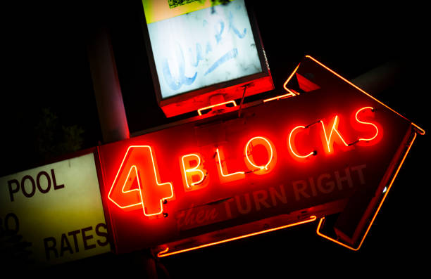 istock Neon Road Sign - Motel, 4 Blocks 1301429417