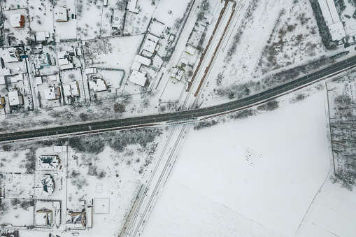 Aerial view of the road bridge over the Opole railway line on a winter day, all covered with snow.
