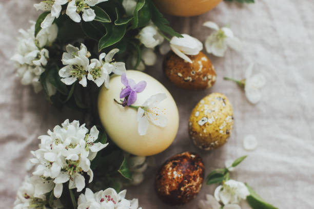 istock Happy Easter! Easter rustic flat lay with eggs and spring flowers on linen. Aesthetic holiday 1301430817